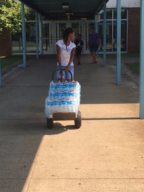 GCSchoolsNC's tweet image. Chase Clark, eighth-grader at Southwest Middle, collected 3,300 bottles of water in 6 days for #HurricaneHarvey relief efforts. #givingback