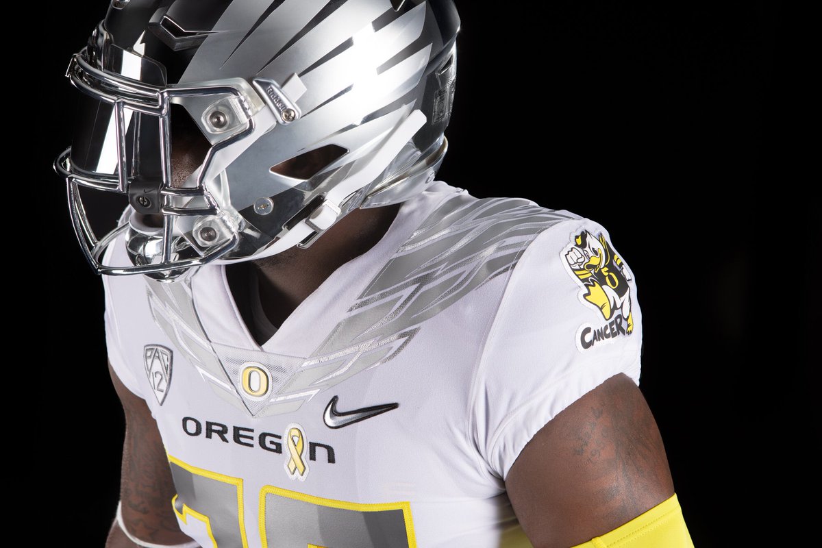 ESPNCFB's tweet photo. Oregon teams up with childhood cancer survivors to unveil awesome #StompOutCancer uniforms to wear versus Nebraska in Week 2. (via @GoDucks) https://t.co/ArLNapWWrN
