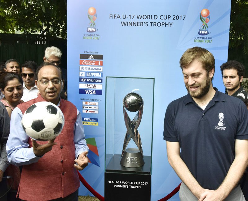 MIB_India's tweet photo. MoS (I/C), Shri @VijayGoelBJP received the #FIFA U 17 World Cup trophy before its Journey to other venues of #FIFA World Cup, in New Delhi https://t.co/XiAv1P5Rwi