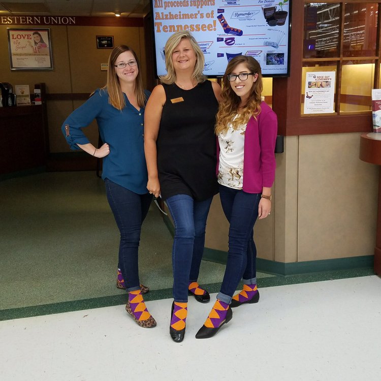 alzTN's tweet photo. Smoky Walk Co-Chair Colleen Milne leads the way at CNB to Sock Out Alzheimer's. #SockOutAlz https://t.co/WLjKJfmpER