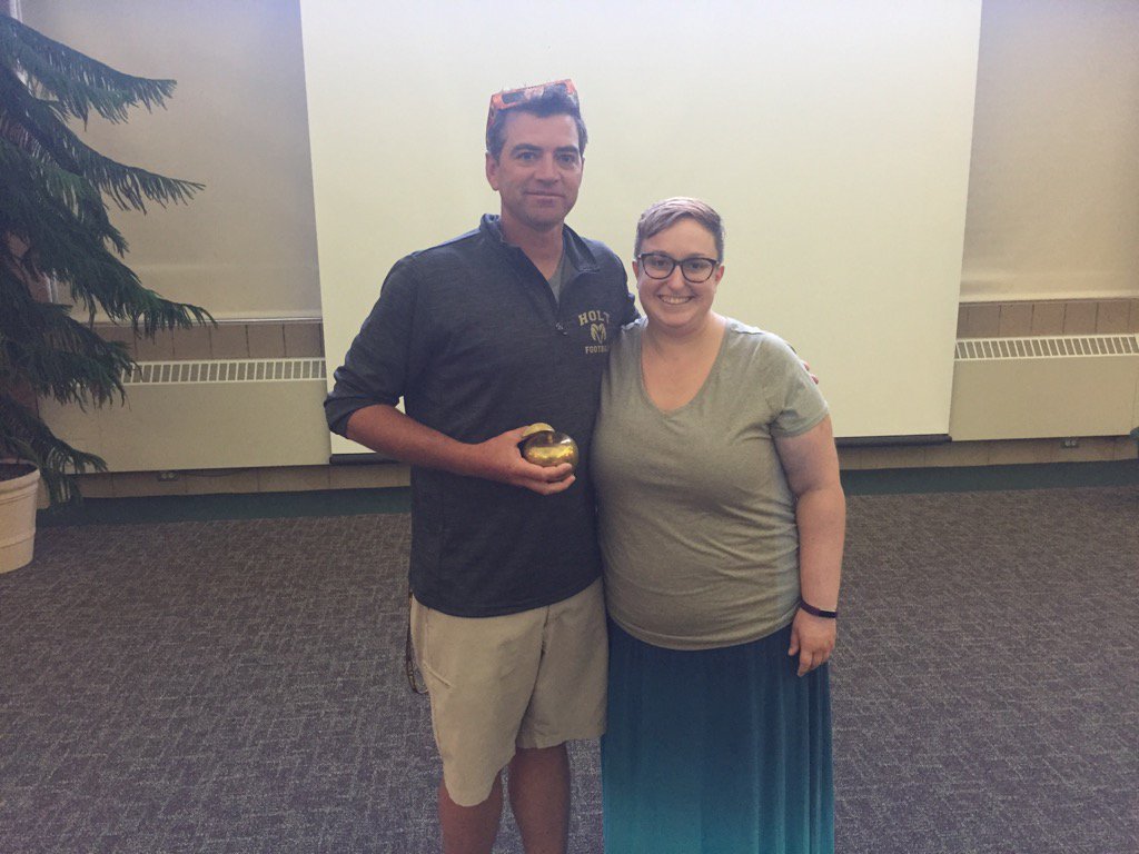 Holt_HS's tweet photo. Mr. Fulk receiving the Golden Apple from Ms. Kauffold. https://t.co/Wlkw5RsqwU