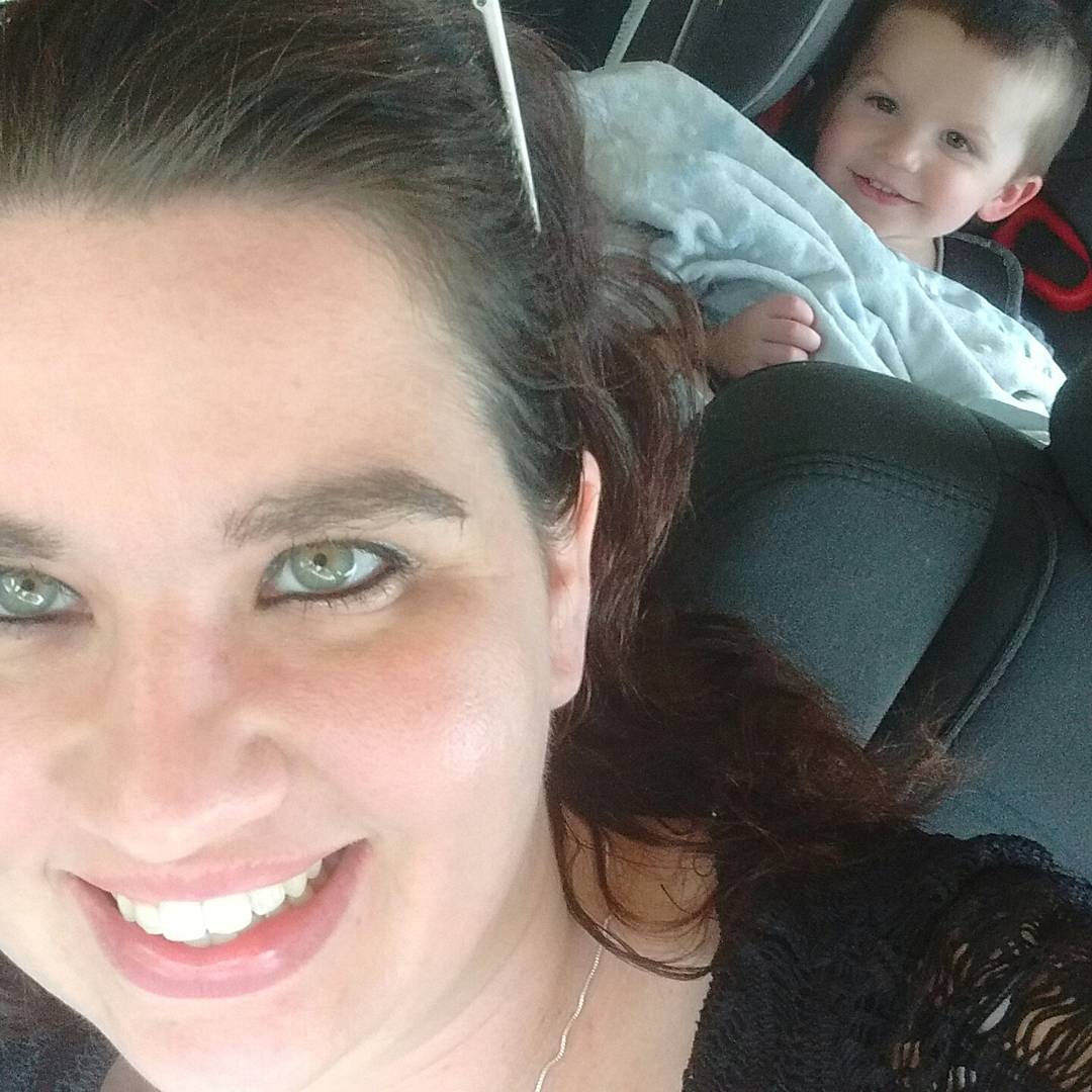 Logan taking a pic w momma