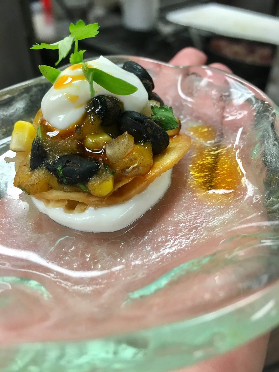 Tonigh's amuse: black bean and roasted corn tostada, with a lime creme fresh and chorizo oil drizzle. #CarettaontheGulf