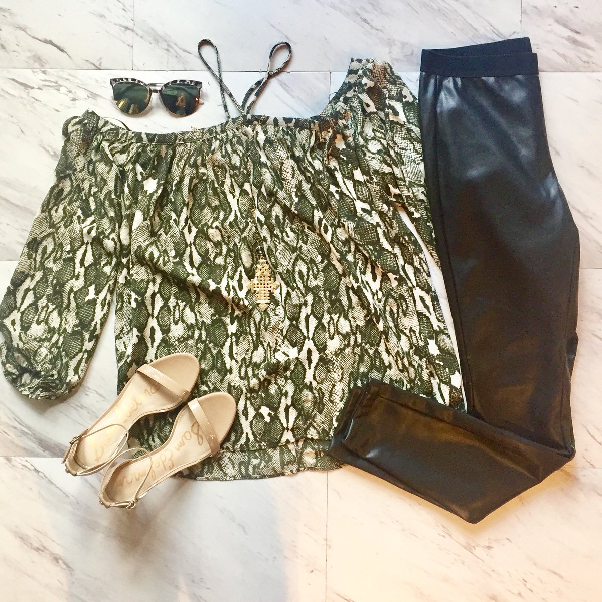 Hand_In_Pocket's tweet photo. Add a bit of sass to your style with this fun python halter top! It goes perfectly with leather leggings and strappy heels for a night out! https://t.co/JWtz6qgoLU