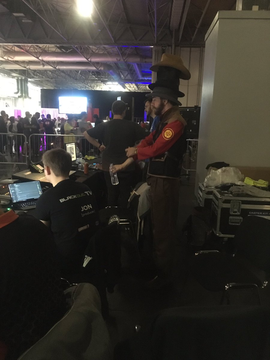 Production crew unaware of the sniper behind them. Wonder what's really in that bottle...