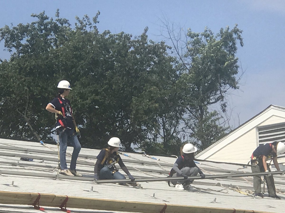 <a href="/the_IDB/">Inter-American Development Bank</a> women of the Energy Division installing solar panels for affordable housing near D.C.  Working on the roof was great. #SolarEnergy