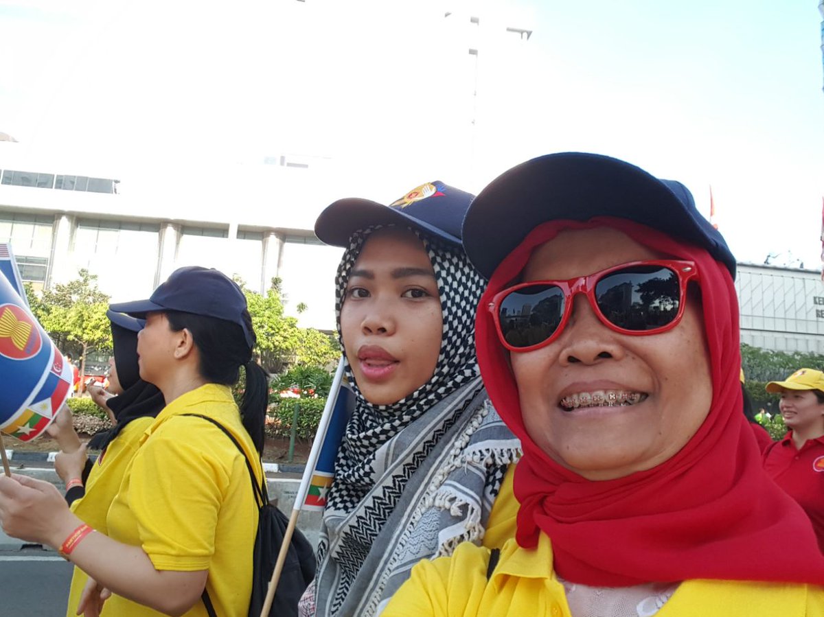 ASEAN's tweet photo. The #ASEAN Secretariat contingent at #asean50parade in Jakarta;    Member States' and Dialogue Partners' Permanent Reps cheer on. https://t.co/Wl8U1HoaKd