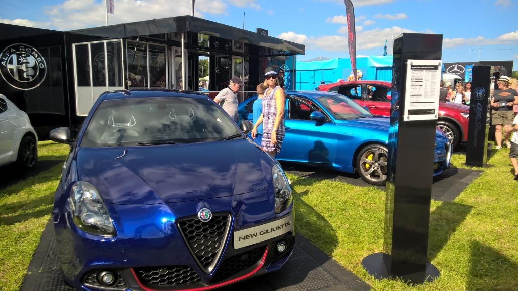 AlfaRomeoUK's tweet photo. Adding some style to the @Carfestevent South stand in the shape of the Alfa #Giulietta. #WeAreAlfa #AlfaStyle https://t.co/PbQUttnjvG