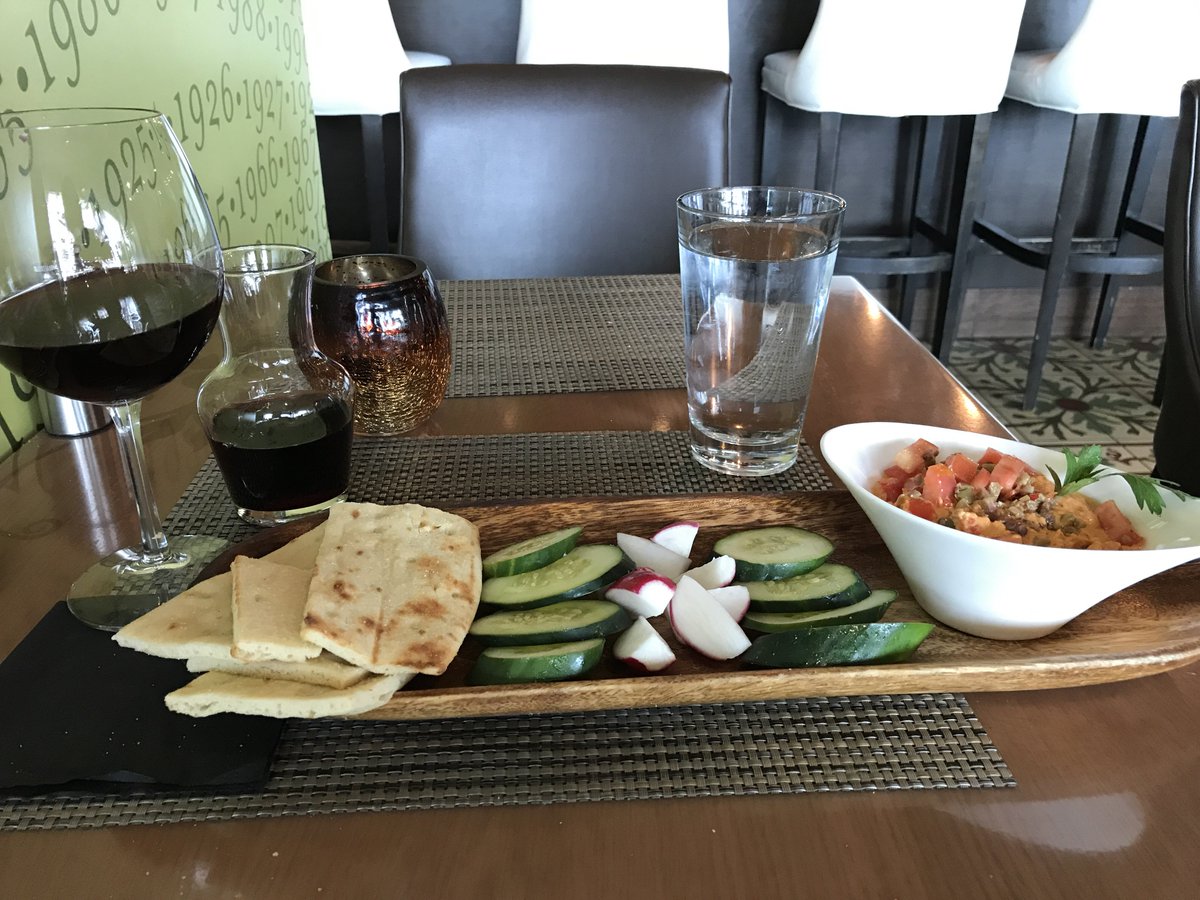 Kittykat001's tweet photo. Dear Paleo gods: Please forgive my transgression but the naan was too tempting for me to pass up. #CLT #winetime #drinkingbeforenoon https://t.co/ZsaIFDGLwI