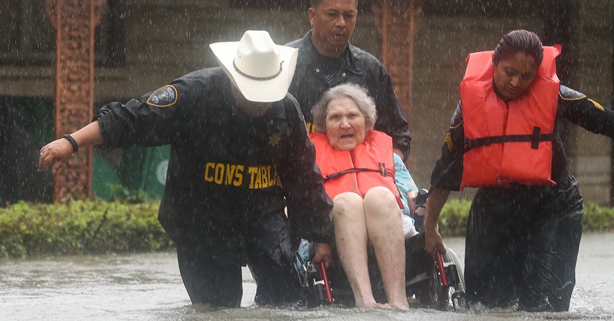 FoxNews's tweet photo. Deputy Constables rescue an elderly woman from rising water in Houston, TX. https://t.co/8xx51h4Iia