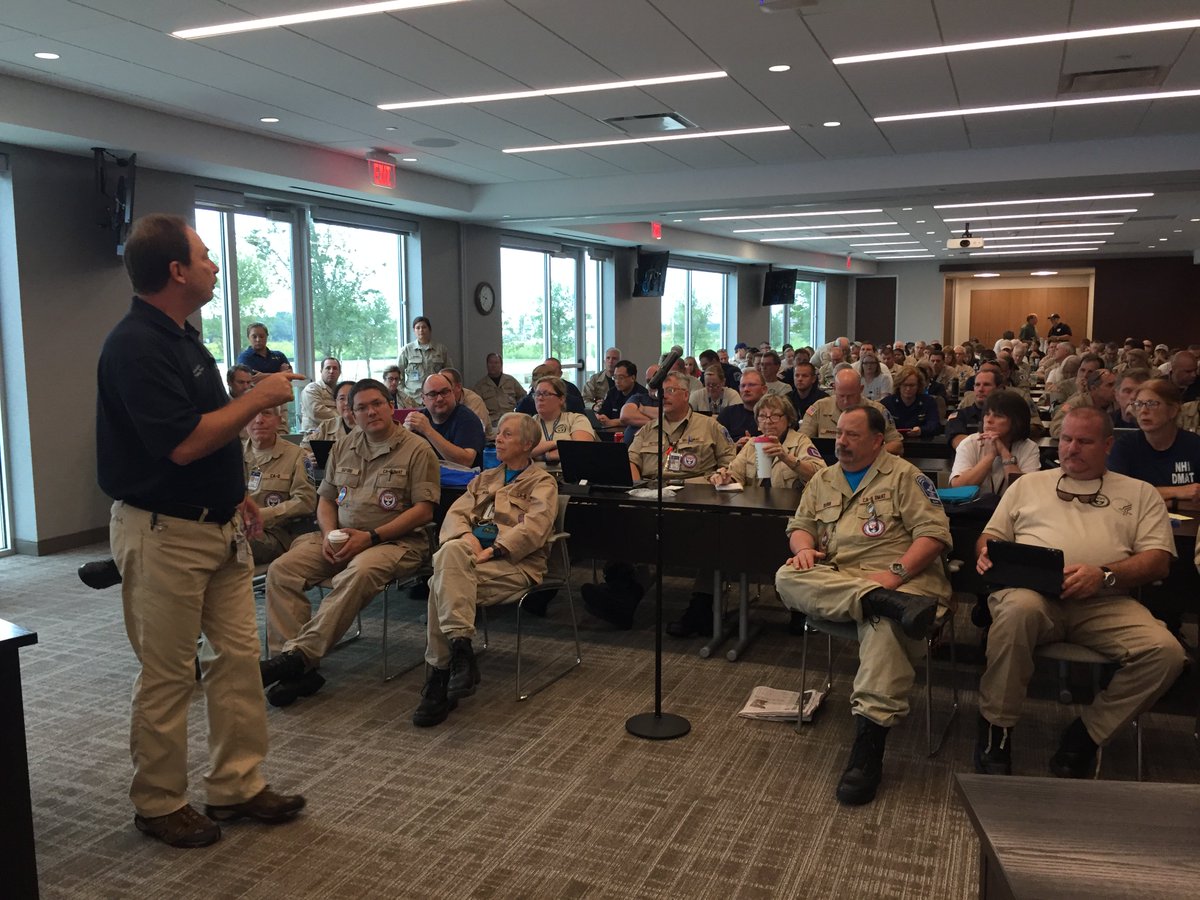 HHSGov's tweet photo. #HHS Disaster Medical Assistance Teams in #Texas attend a briefing as they prepare to treat those affected by #HurricaneHarvey. https://t.co/AjuQEWraAN