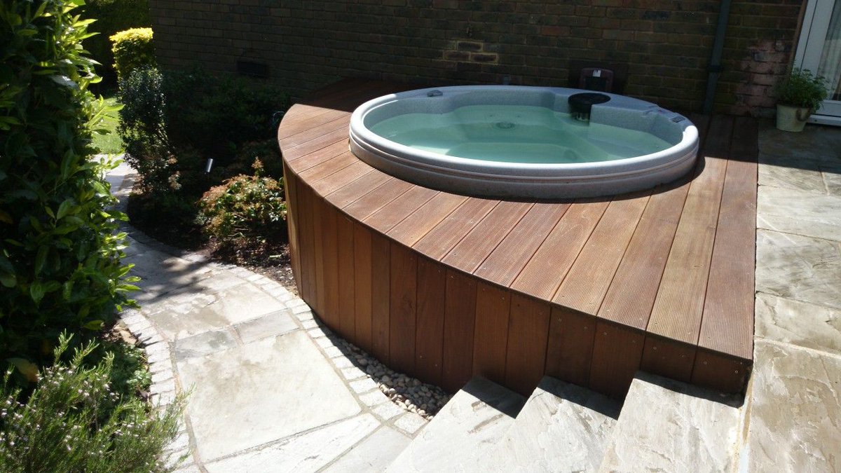 Groundteam's tweet image. Back Garden Patio Split-level back garden in Wimbledon featuring hot tub with hardwood ... groundteam.co.uk/landscaping-pr…