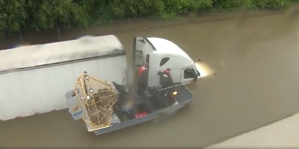 BusinessInsider's tweet photo. Dramatic video shows the life-saving rescue of a stranded truck driver in Houston https://t.co/cIPhvsDKUb https://t.co/1Vgklggqzy