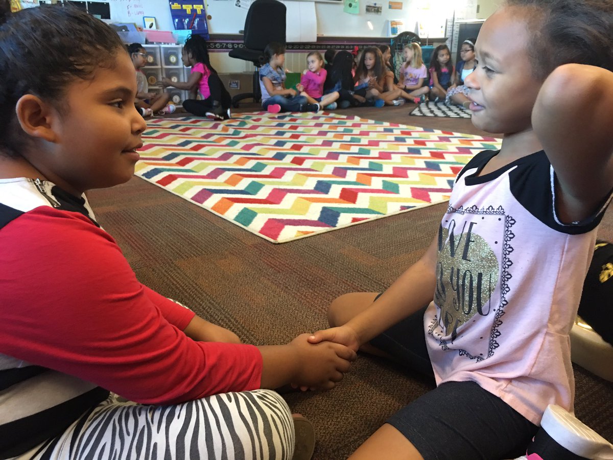 High Fives to find a partner during morning meetings.  Best part of morning meetings - learning the skills of introductions.