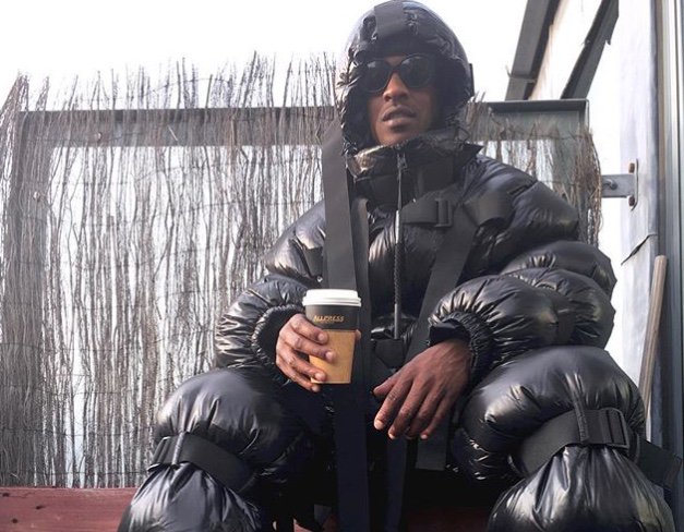 Skepta wears a Burberry puffer jacket layered over our London Icons print  T-shirt at the #Burbe…