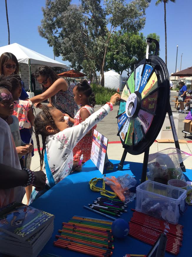 Girl spinning a wheel for a prize