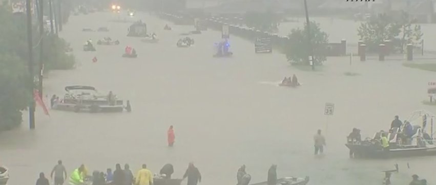 10News's tweet photo. #BREAKING A road is a river of boats right now in Houston. Watch the rescues unfold #LIVE on Facebook. https://t.co/pVYx5NCcTA https://t.co/C75NcP7MnV