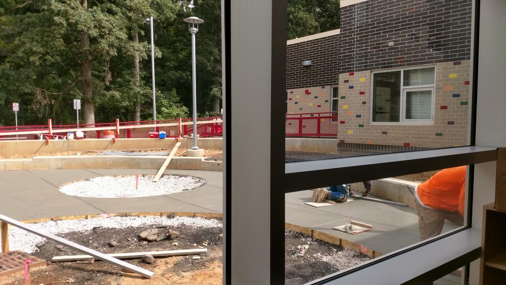 RelayESLibrary's tweet photo. Concrete was poured into the Library courtyard today! I see outdoor read-alouds in our future! @jrbarnett_ @franglick #bcpslms #RelayES4 https://t.co/XQA9dfl3z2