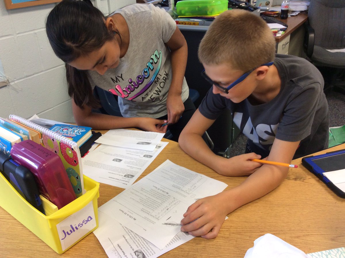 ruffteacher's tweet photo. Ss are practice grading essays. Learning 5th grade writing expectations. Great discussions #ruffpups2025 #junctionproud #Turner202Strong https://t.co/HrXSWGDh0j