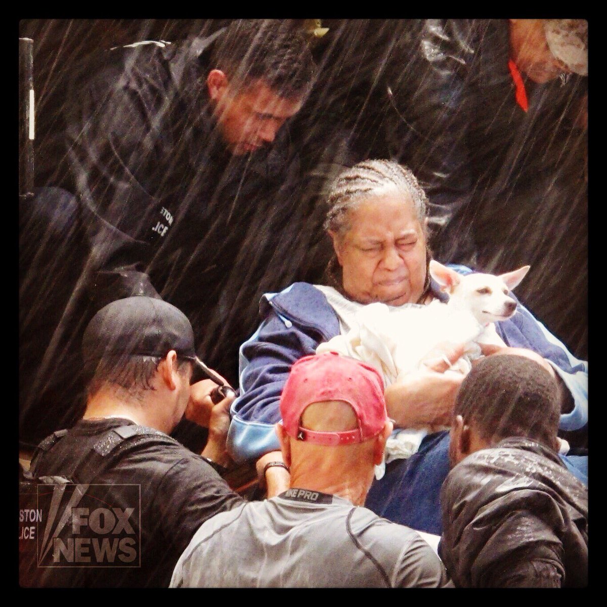 A woman and dog arrive at the #Houston Convention Center after being evacuated from #Harvey floods. <a href="/FoxNews/">Fox News</a> fxn.ws/2wlkeKA