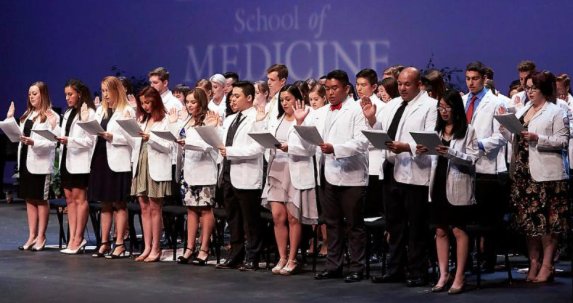unlvmedicine's tweet photo. Inaugural students receive their White Coats! READ MORE: https://t.co/oBvZFp2xn9 

Your Weekly Newsletter Is Here_ ISSUE 108! #UNLV https://t.co/SV8EXsBSvp
