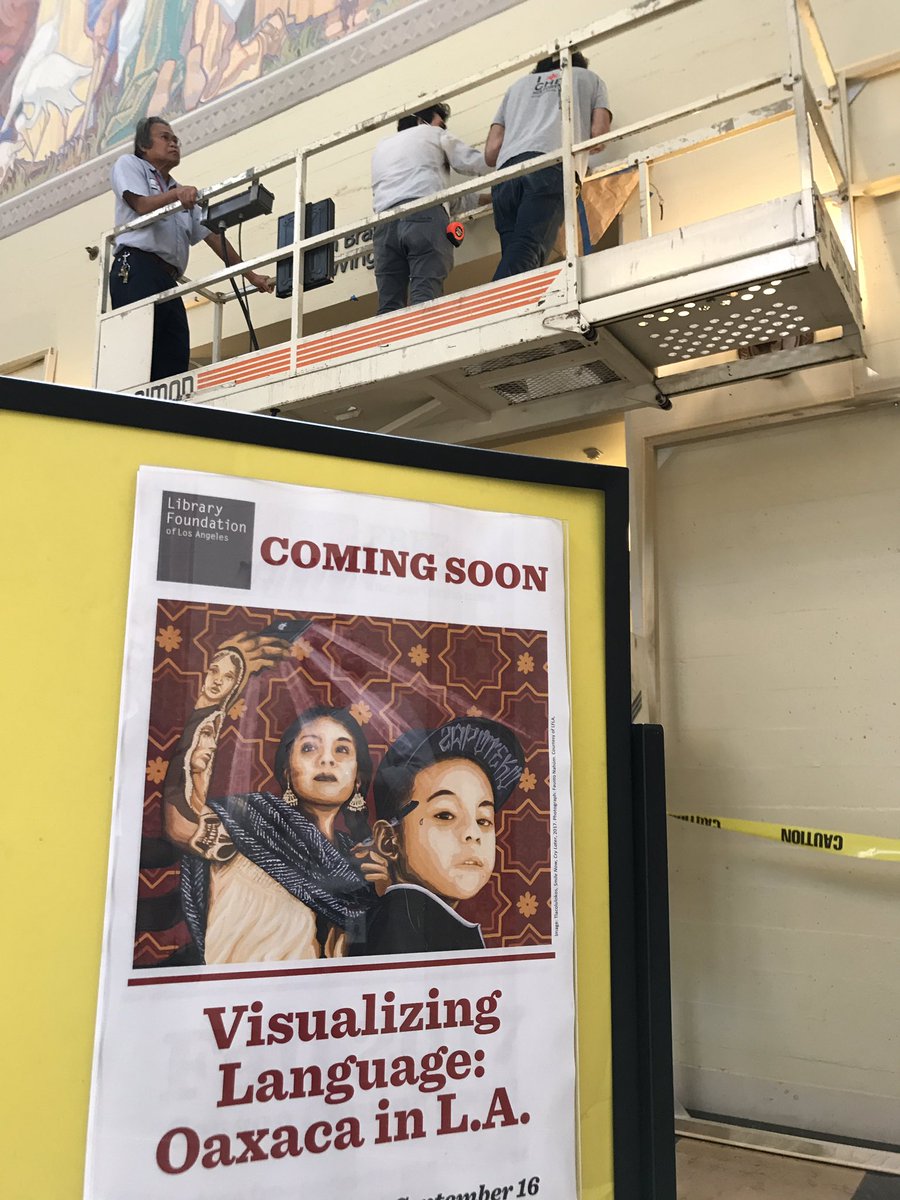 Poster with Visualizing Language in foreground with workers in the background.