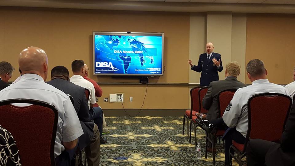 DoW_DISA's tweet photo. #DISA's Col Brad Barnhart, chief of Mission Partner Engagement Office, brief mission and industry partners at the #AFITC17 DISA 101 session. https://t.co/li43OVEuao