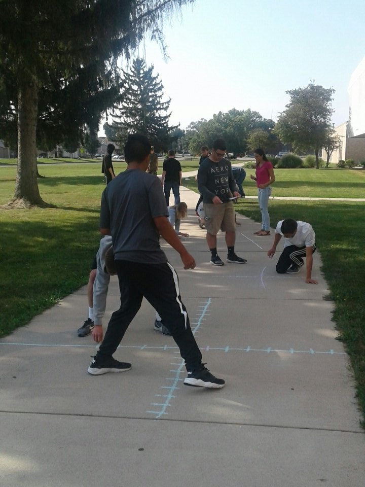 YHS_Scholtes's tweet photo. Who says summer is over? Sidewalk chalk at Central graphing functions. #wevegotproblems https://t.co/L7vpKm65vw