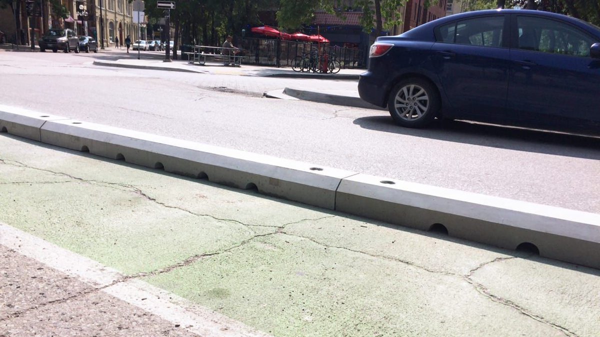 FastCompany's tweet photo. These temporary bike lane barriers let cities experiment with better biking infrastructure https://t.co/sq0cVSFz5J https://t.co/x5Wnpb7Q4f