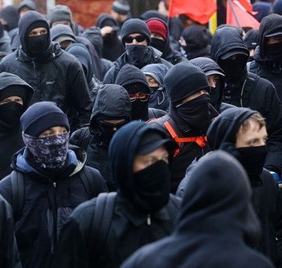 DineshDSouza's tweet photo. From the violent masked thugs of the KKK to the violent masked thugs of #Antifa the Democratic Left maintains continuity with its past https://t.co/jIZ4RqmgI9
