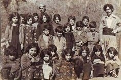 An old photo of a group of pupils with their teachers.