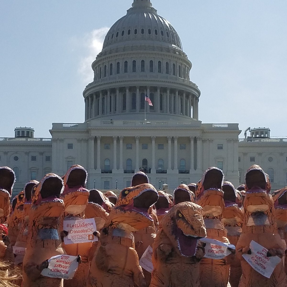 BooksbyMT's tweet photo. Yes, this REALLY happened in #DC today! #Dinos protesting against proposed funding cuts to @PeaceCorps &amp; @AmeriCorps #dinosinDC #PaleoStomp https://t.co/KN0Z6vmLLI