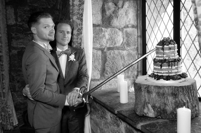 CloghanCastle's tweet photo. The cutting of the cake with the castle sword knife! Congratulations Chris &amp; Josh👨‍❤️‍💋‍👨
#castlepride #wedding #specialday #westofireland https://t.co/aR4rwHXbm0