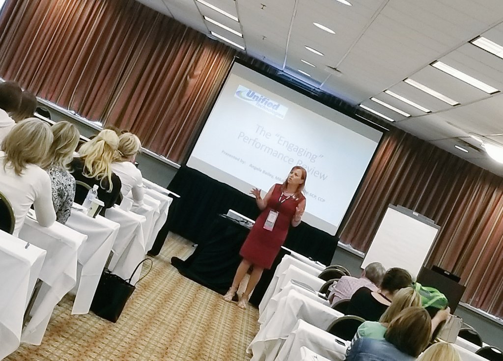 stacimcarter's tweet photo. The incredible @angelabaileyhr convincing us to toss our old performance reviews. #kyshrm2017 https://t.co/6ObsjaLO0c