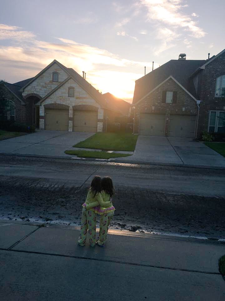 abc13houston's tweet photo. A beautiful moment captured in #Pearland of twin girls looking at the sunrise after water receded in their neighborhood. 💕 #texasstrong https://t.co/SQ3iDefGWa