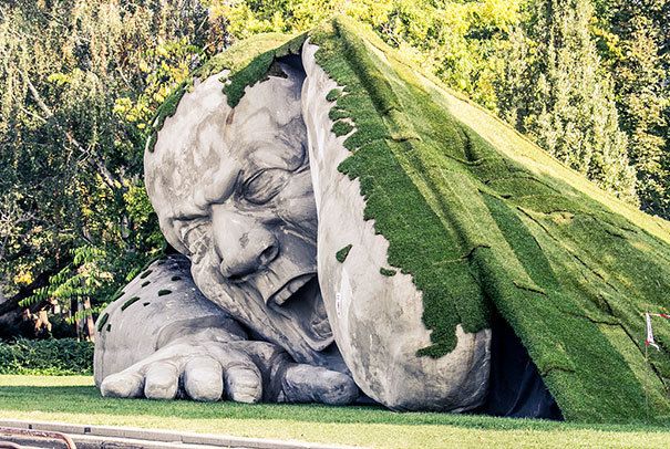 archpng's tweet photo. Giant statue crawls out of the ground in Széchenyi Square, Budapest. Photo by Laslow Barkoni https://t.co/G55T74KtcT