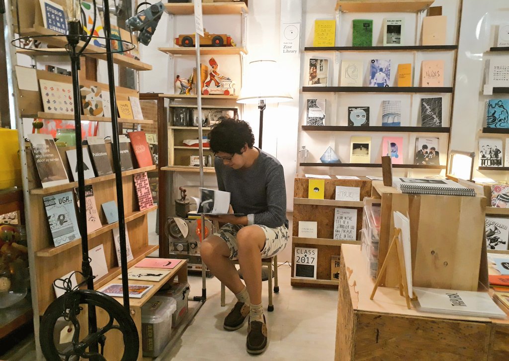 pic i took of austere reading #zines @studiosoupMNL !!! it's a store and library of great art/printed material! if uve never been here wtf!!