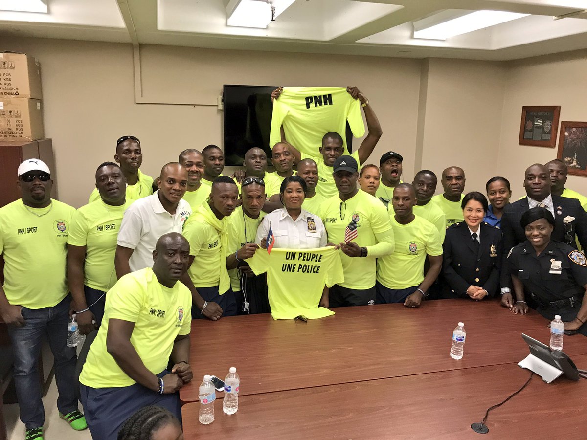 NYPDCommAffairs's tweet photo. Assistant Chief Royster welcomes the Haiti Police Nationals Soccer team to Police HQs! Exciting charity game this weekend. #NYPDSports https://t.co/iiFBxpMsU0