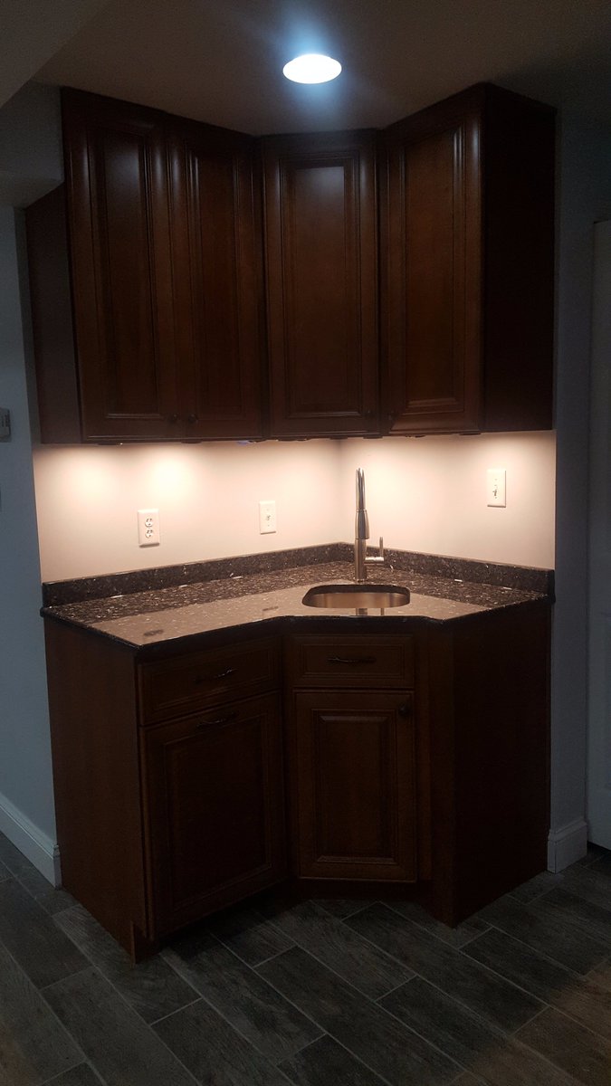 accurateupgrade's tweet photo. A beautiful wet bar with blue pearl granite counter tops with under cabinet lighting. Call or message us today so we can upgrade your home! https://t.co/6MvWxwn45G