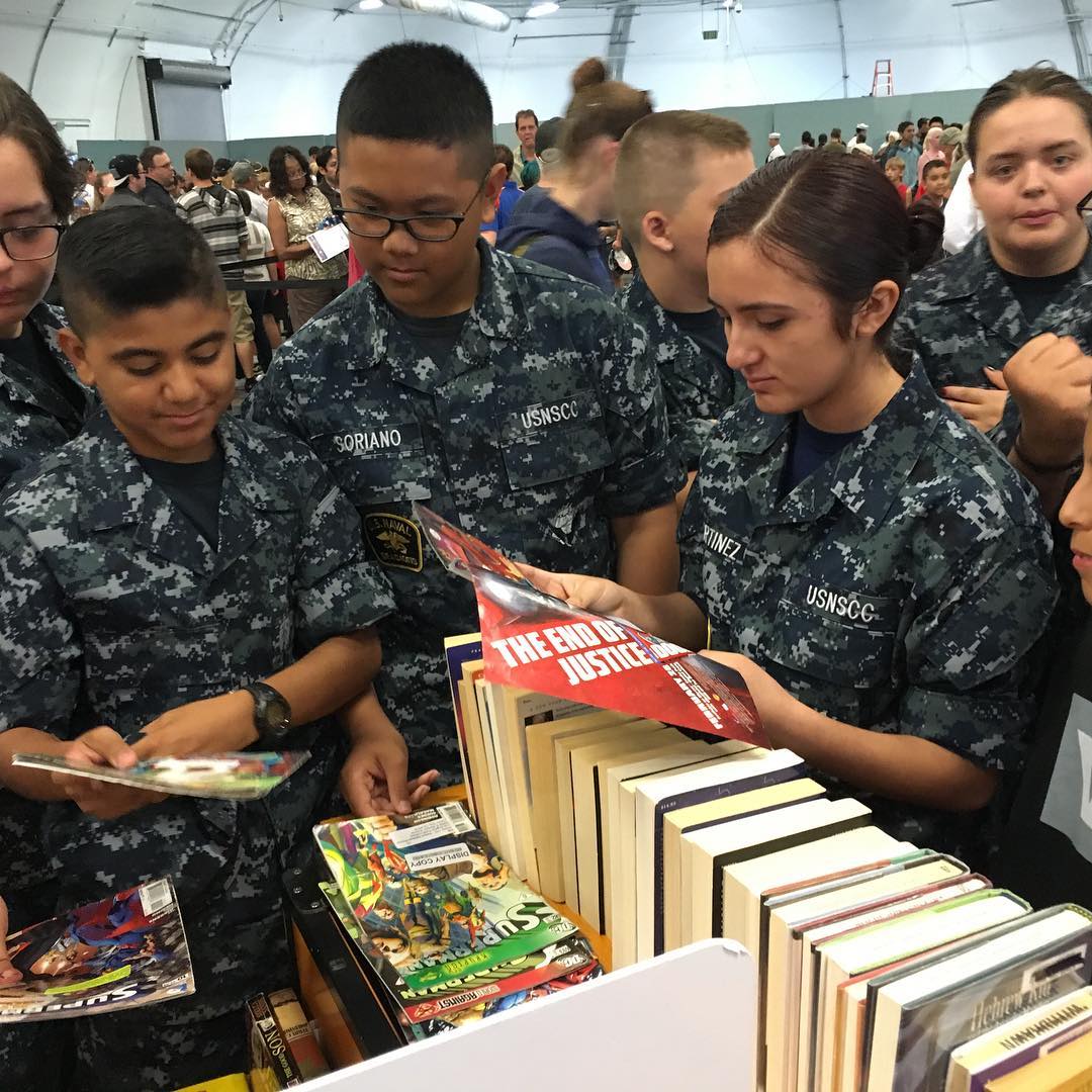 Cadets looking at books