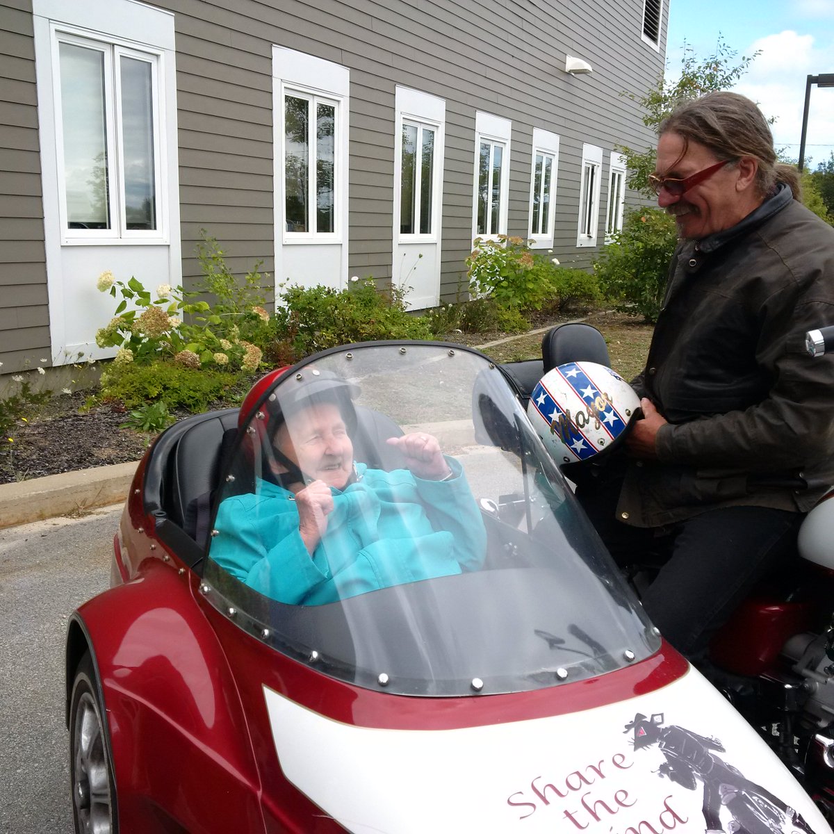 Wharf Rat Rally with Beaner and Friends riding around with Residents in his side car.