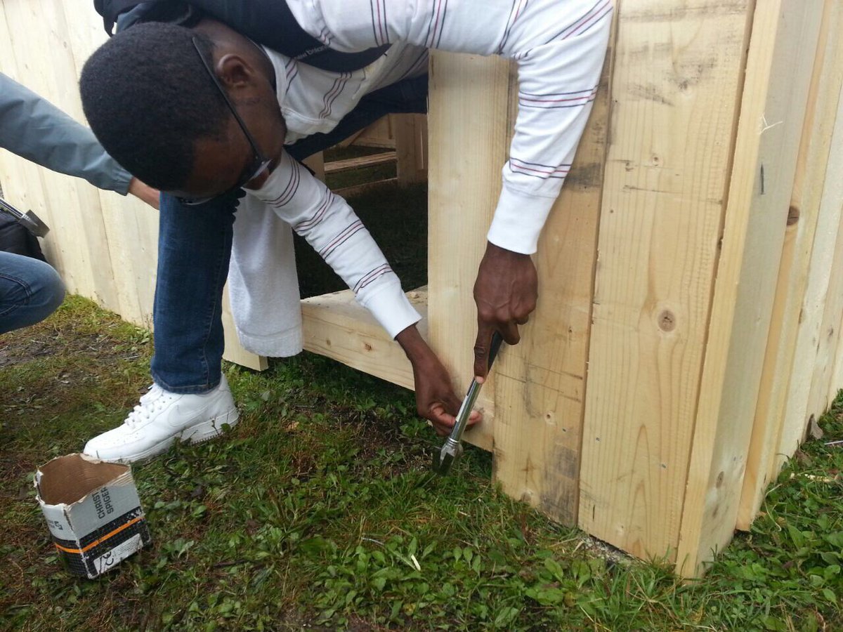 jrfcaribbean's tweet photo. Working hard on and off the pitch. #TeamGrenada getting involved in the building of clubhouses during a break at the @homelesswrldcup https://t.co/o93iuSLNpw