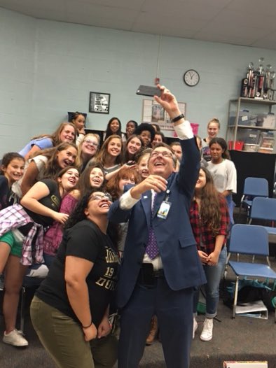HughesMSFCPS's tweet photo. Dr. Brabrand working on his selfie skills with Ms. Milhoan's choir class. #firstweekfairfax #OurFCPS @FCPSSupt https://t.co/ymrdeif1SF