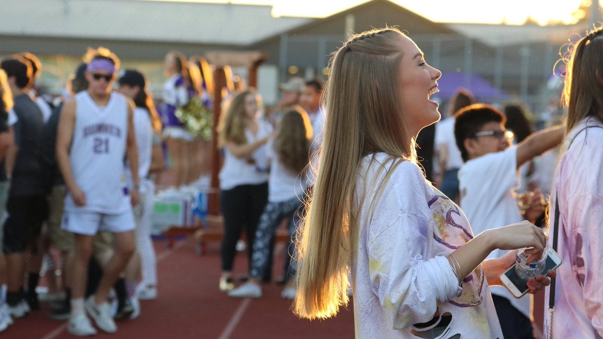 KING5Sports's tweet photo. Ellie Riddell, a junior at Sumner High School, laughs with friends at the Friday night football game against #BonneyLake. #k5sports #biggame https://t.co/SmvoQZb5qO