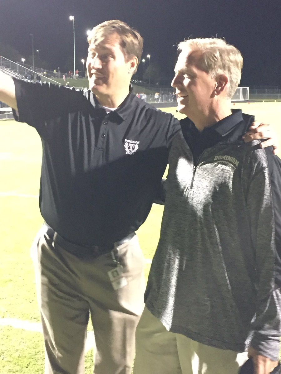 DominionLcps's tweet photo. Dr. Brewer, principal, congratulating Coach Buckwalter on the field after the game. https://t.co/24LvToasMQ
