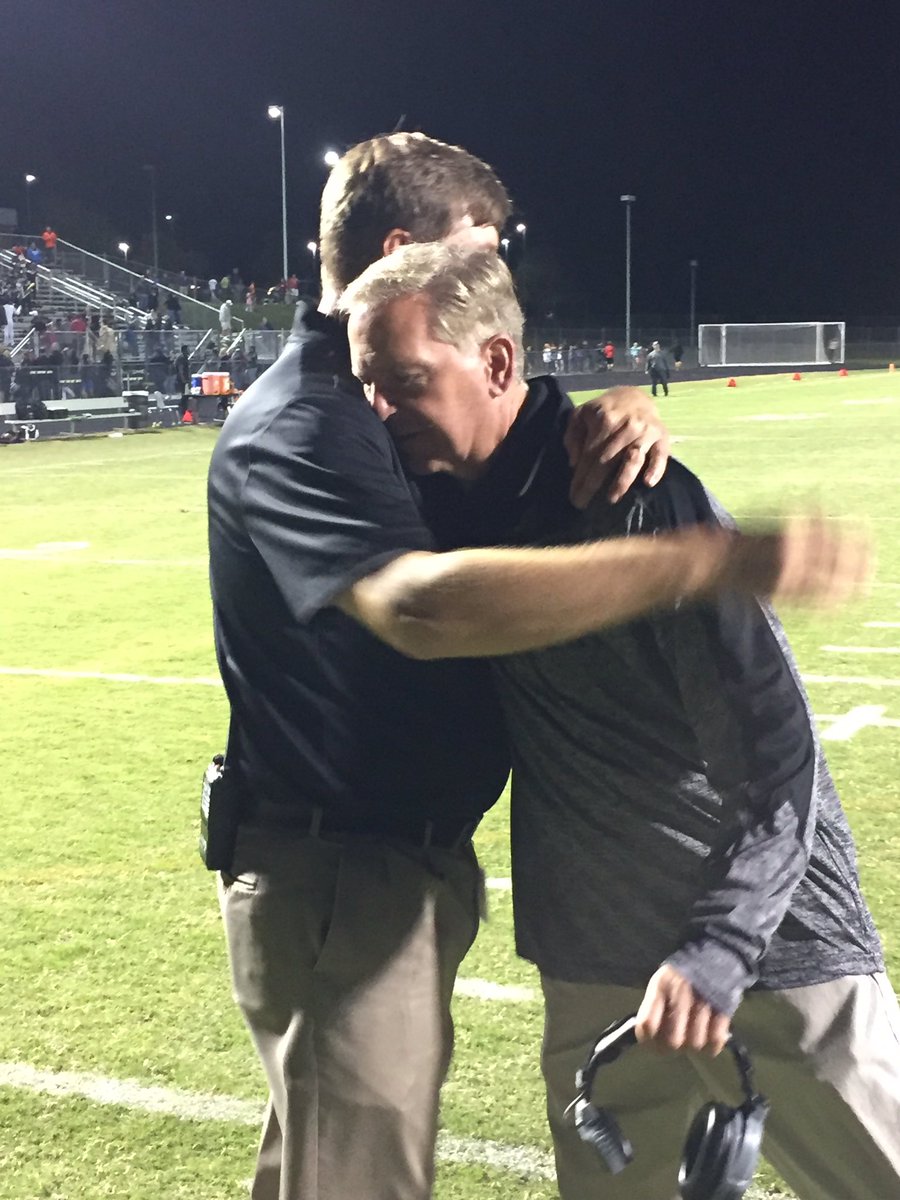 DominionLcps's tweet photo. Dr. Brewer, principal, congratulating Coach Buckwalter on the field after the game. https://t.co/24LvToasMQ