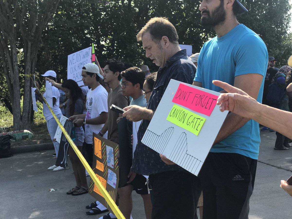 LoriBrownFox4's tweet photo. People mad about the reservoir release of floodwaters into their homes in Katy Texas hold signs up for government officials. https://t.co/mNRnIp3XF6