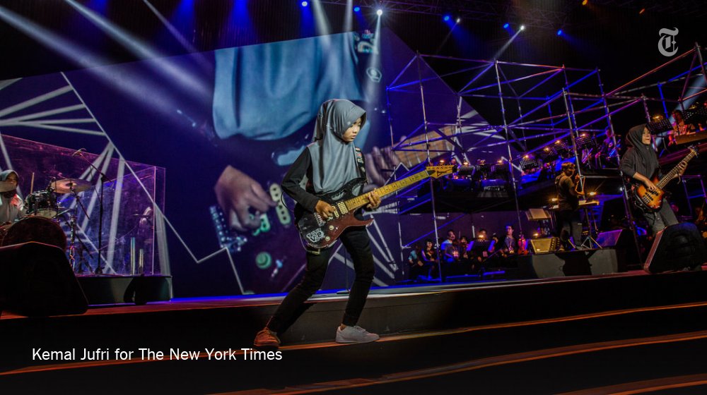 nytimes's tweet photo. They've been pelted with rocks and threatened with decapitation. But 3 teen girls in Indonesia still play metal. https://t.co/vhDlc2Ivxs https://t.co/Sm4qYZ9WwU