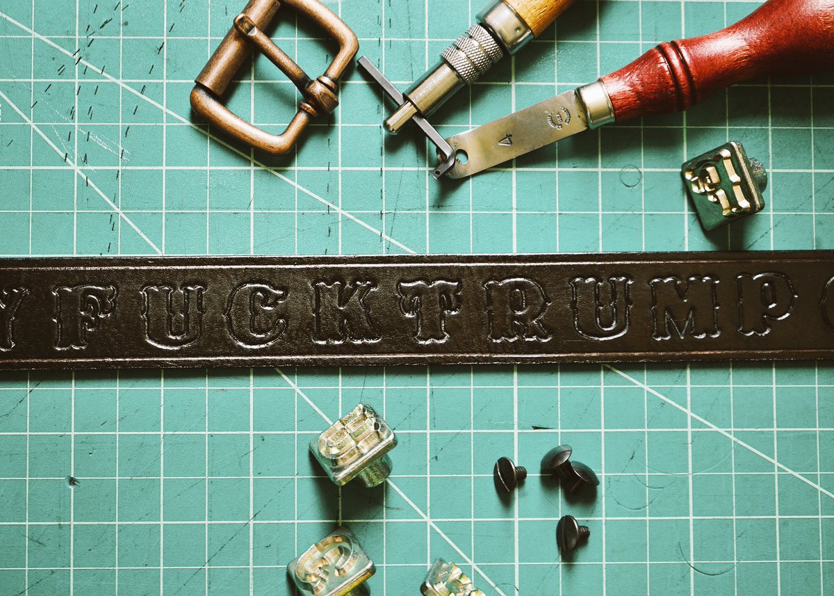 byanthonytaylor's tweet photo. Wanted to make a new belt 🤷🏾‍♂️think Ima make more: Handmade, genuine leather, "FUCKTRUMPGETMONEY" embossed. https://t.co/XUkwf2zb89