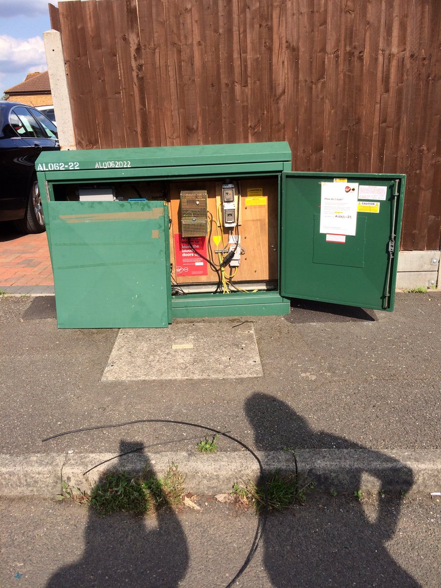 R2GStAlbans's tweet photo. @virginmedia is this the usual state your engineer leaves a green box? Note the wires all over the pavement too https://t.co/ikcylcCF5p